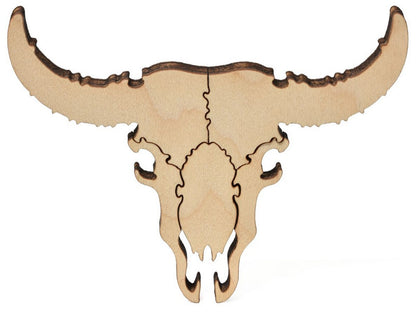 A closeup of pieces that show a bull's skull from the puzzle, Vaqueros Andres, by Duke Beardsley.