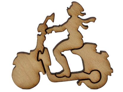 A closeup of pieces shaped like a person driving a Vespa scooter.