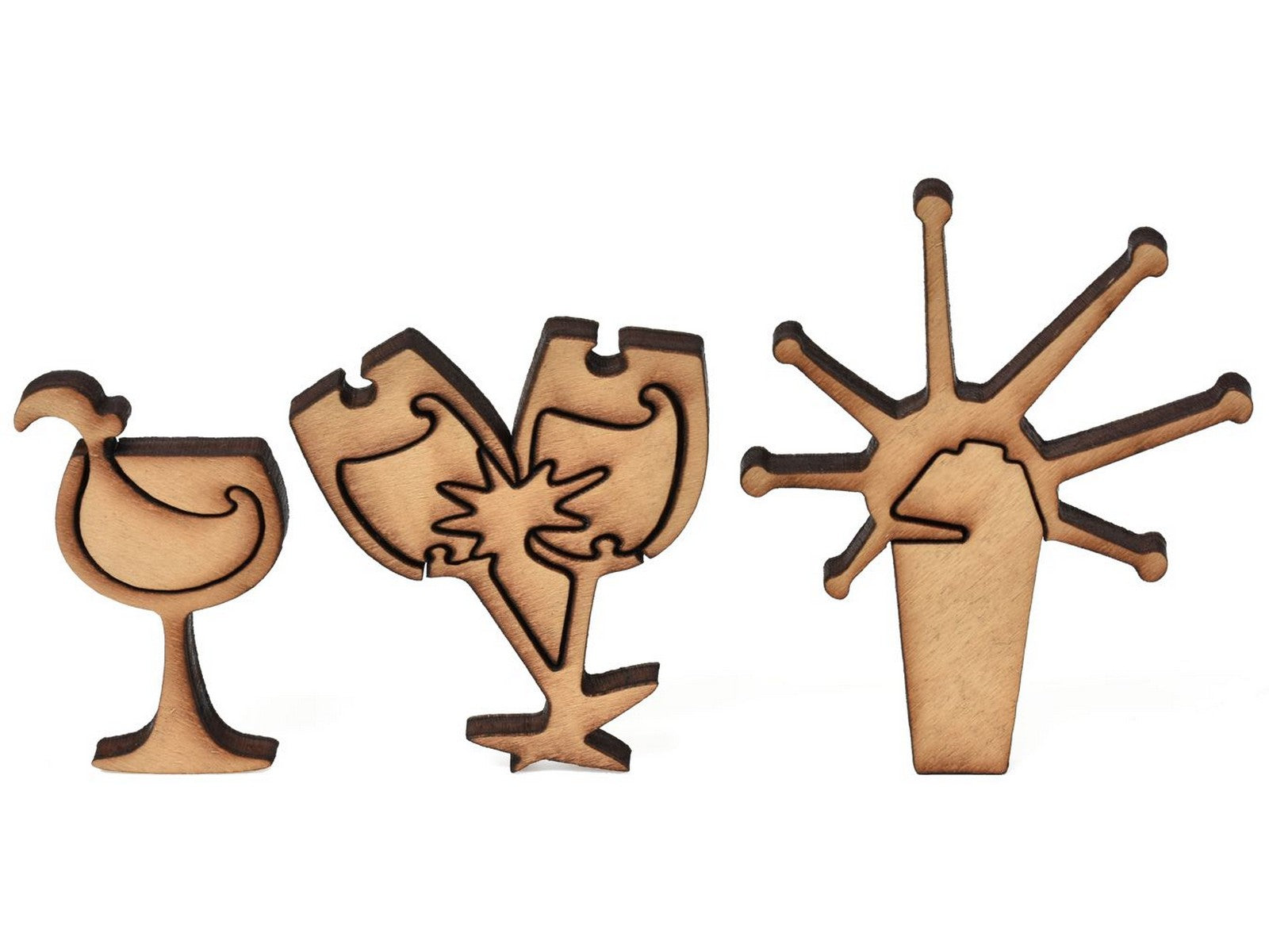 A closeup of pieces showing a cocktail shaker and champagne glasses.
