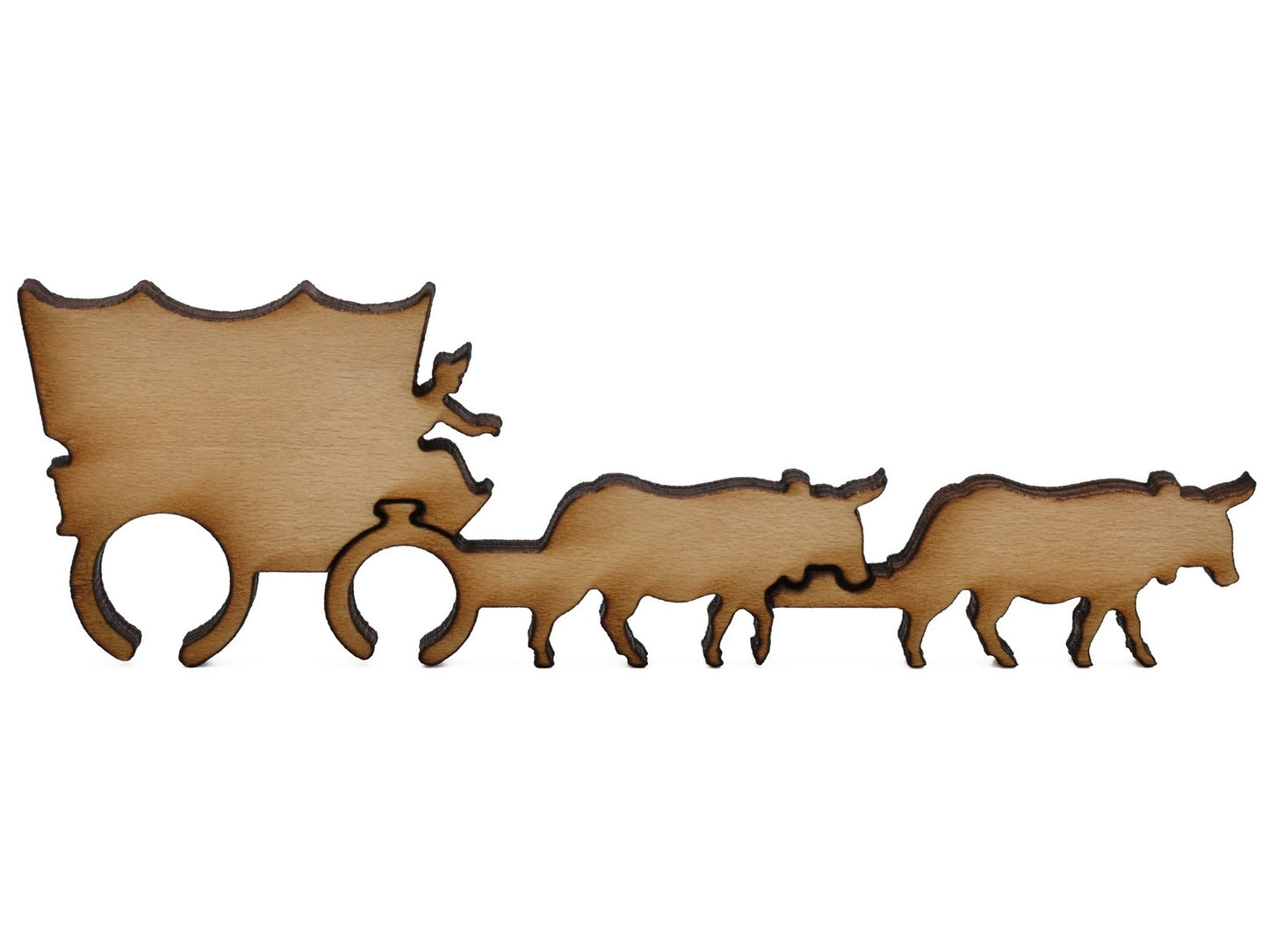A closeup of pieces shaped like a covered wagon being pulled by cattle.