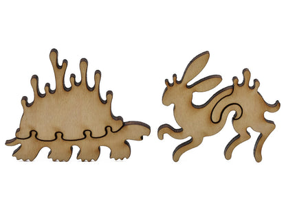 A closeup of pieces shaped like a whimsical turtle and rabbit.
