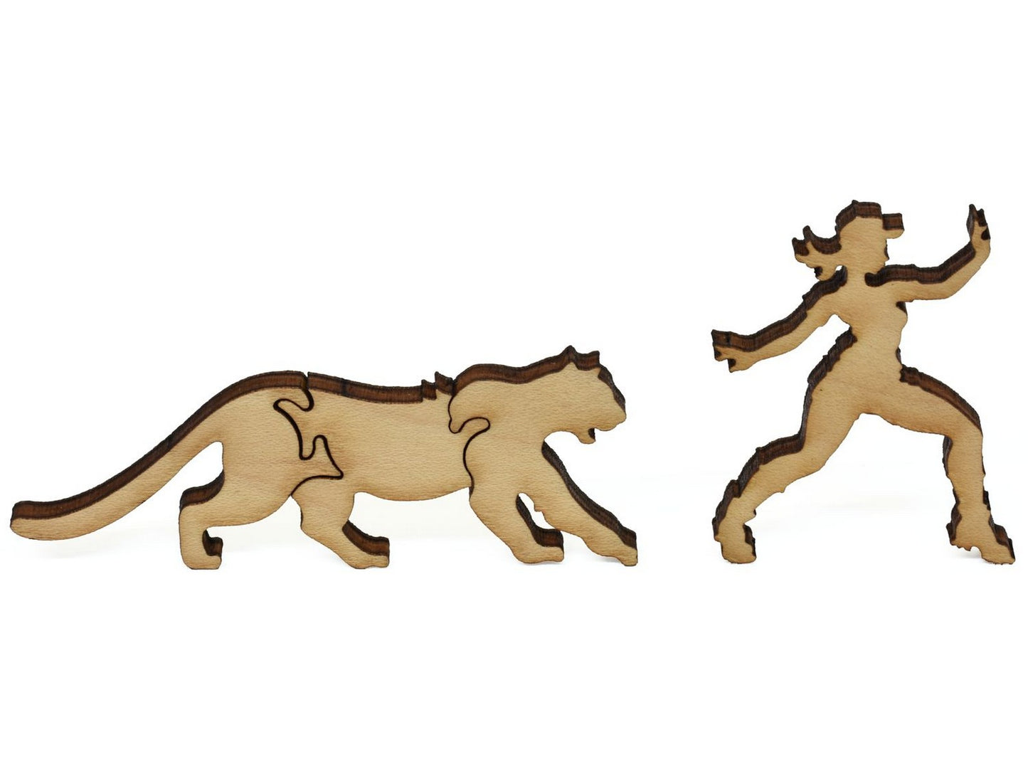 A closeup of pieces showing a hiker and a mountain lion.