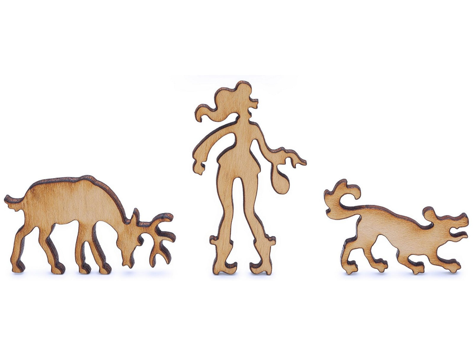 A closeup of pieces shaped like a woman, deer, and dog.