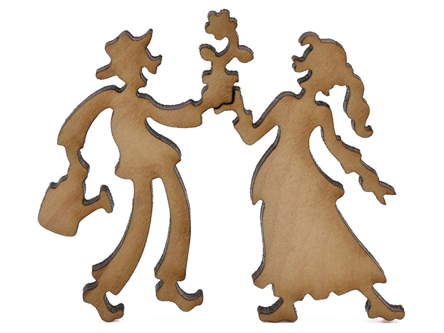 A closeup of pieces shaped like two people with a flower.