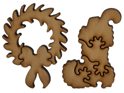 A closeup of pieces shaped like a wreath and a stocking.