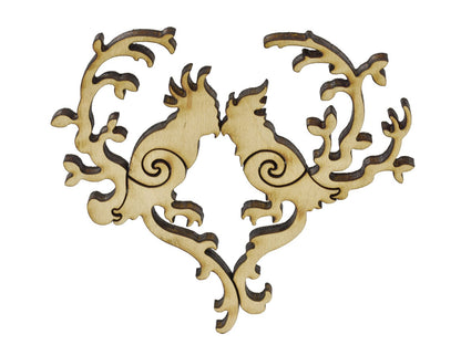A closeup of pieces in the shape of two birds sitting in a heart.