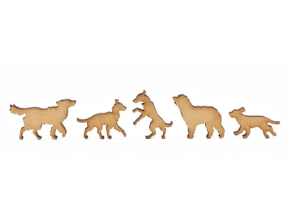 A closeup of pieces in the shape of six different dogs.