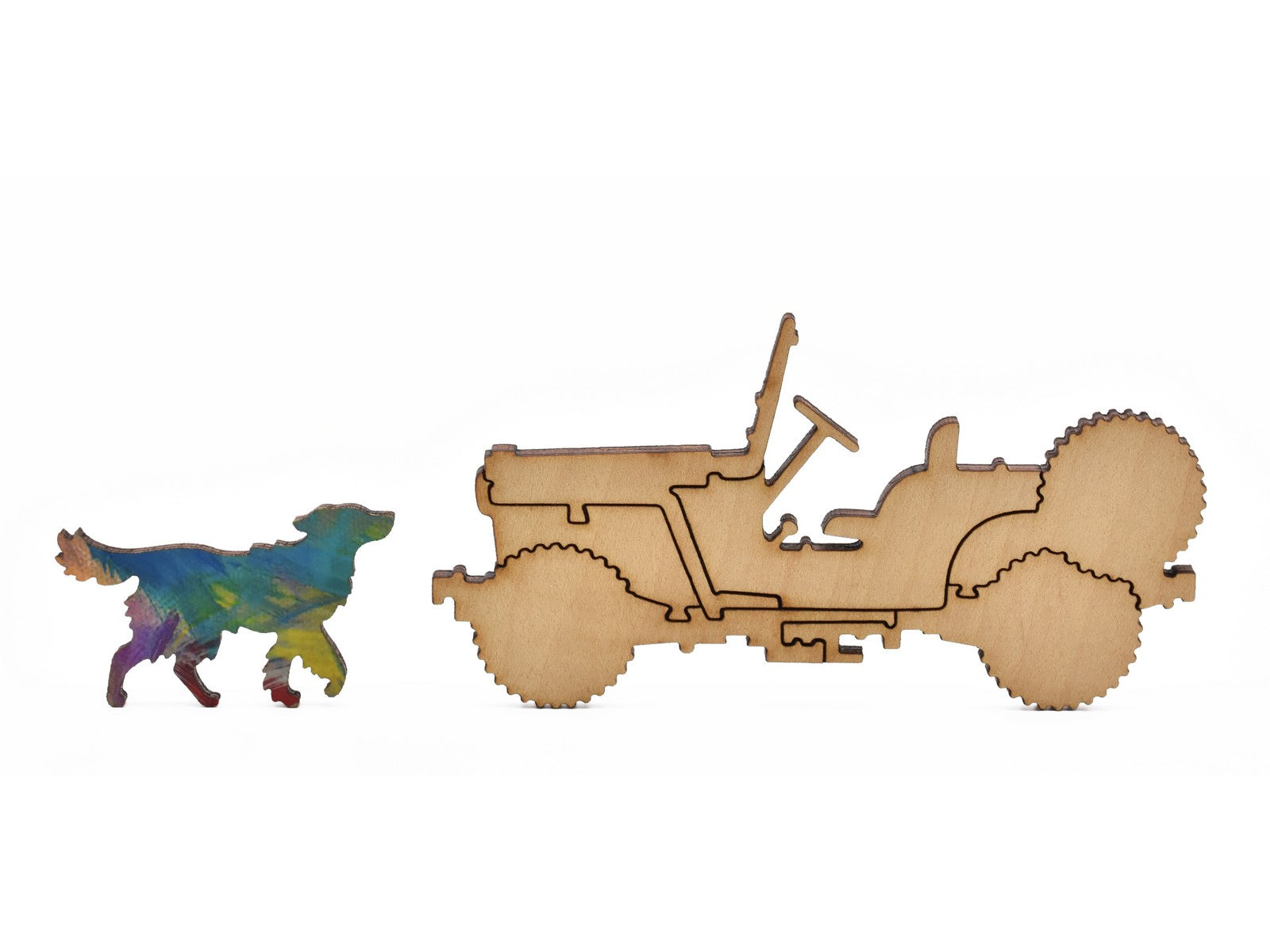 A closeup of pieces in the shape of a jeep and a dog.