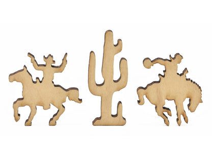 A closeup of pieces in the shape of cowboys and a cactus.