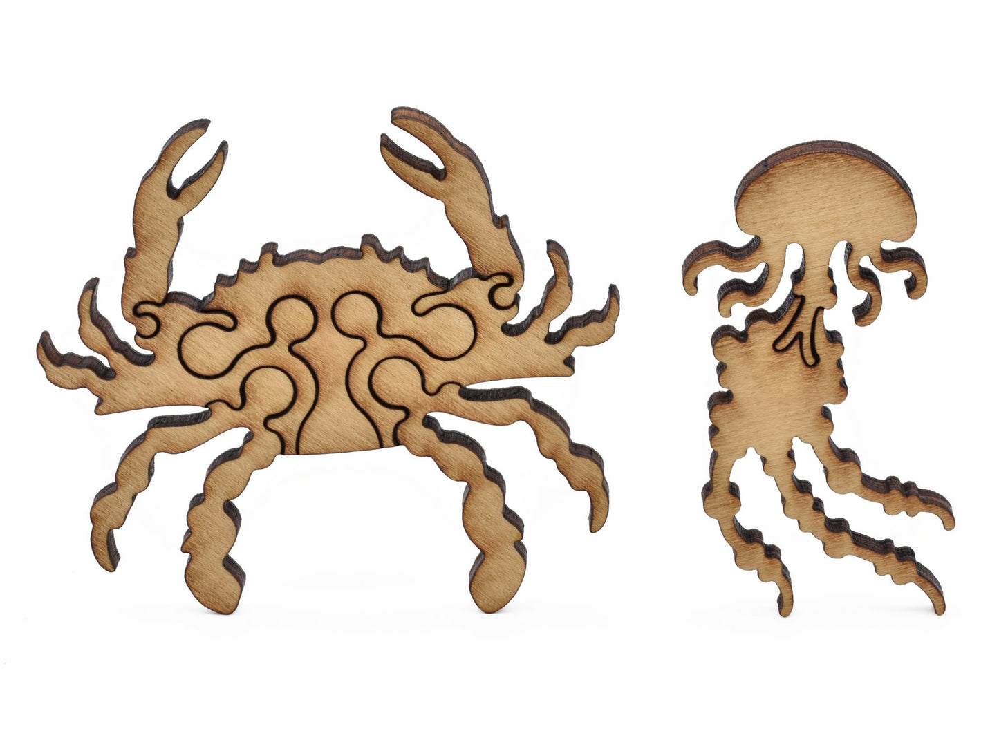A closeup of pieces showing a crab and a jellyfish.