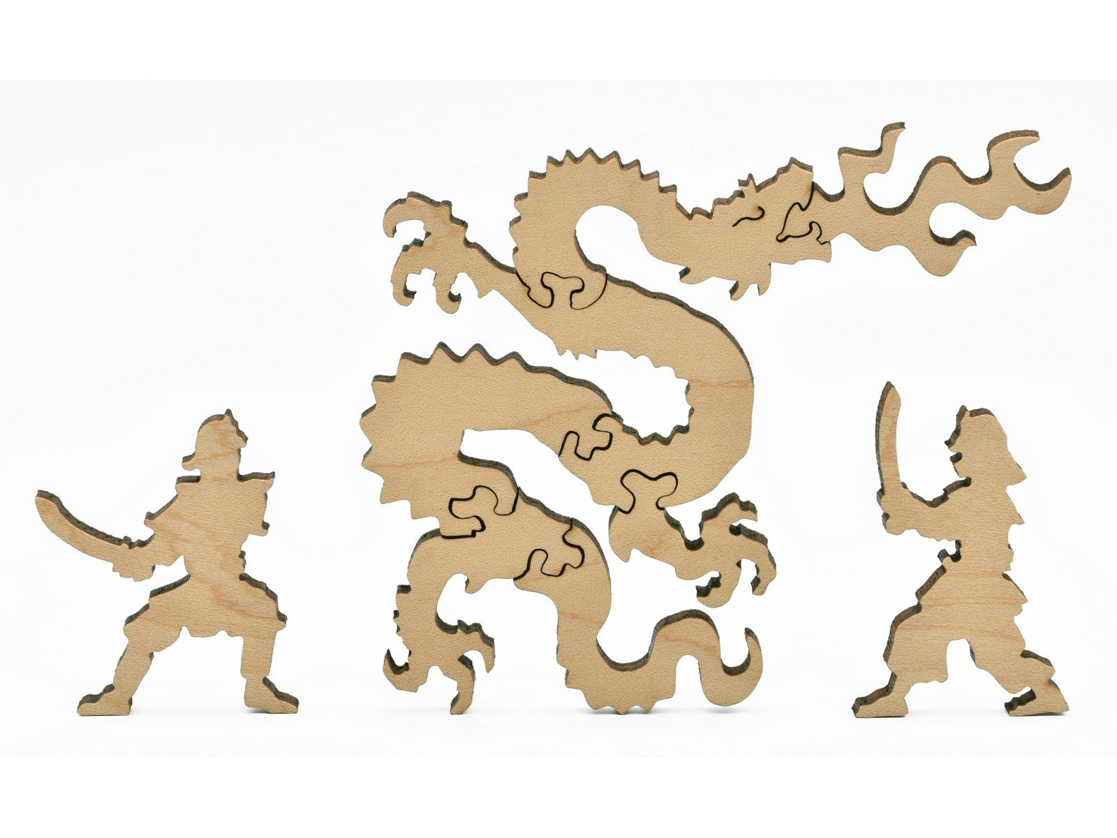 A closeup of pieces in the shape of a dragon and samurai warriors.