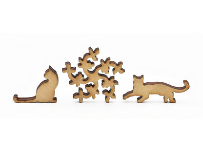 A closeup of pieces in the shape of cats and flowers.