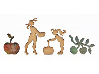 A closeup of pieces in the shape of people gardening and fruits.