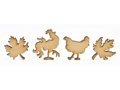 A closeup of pieces in the shape of chickens and leaves.
