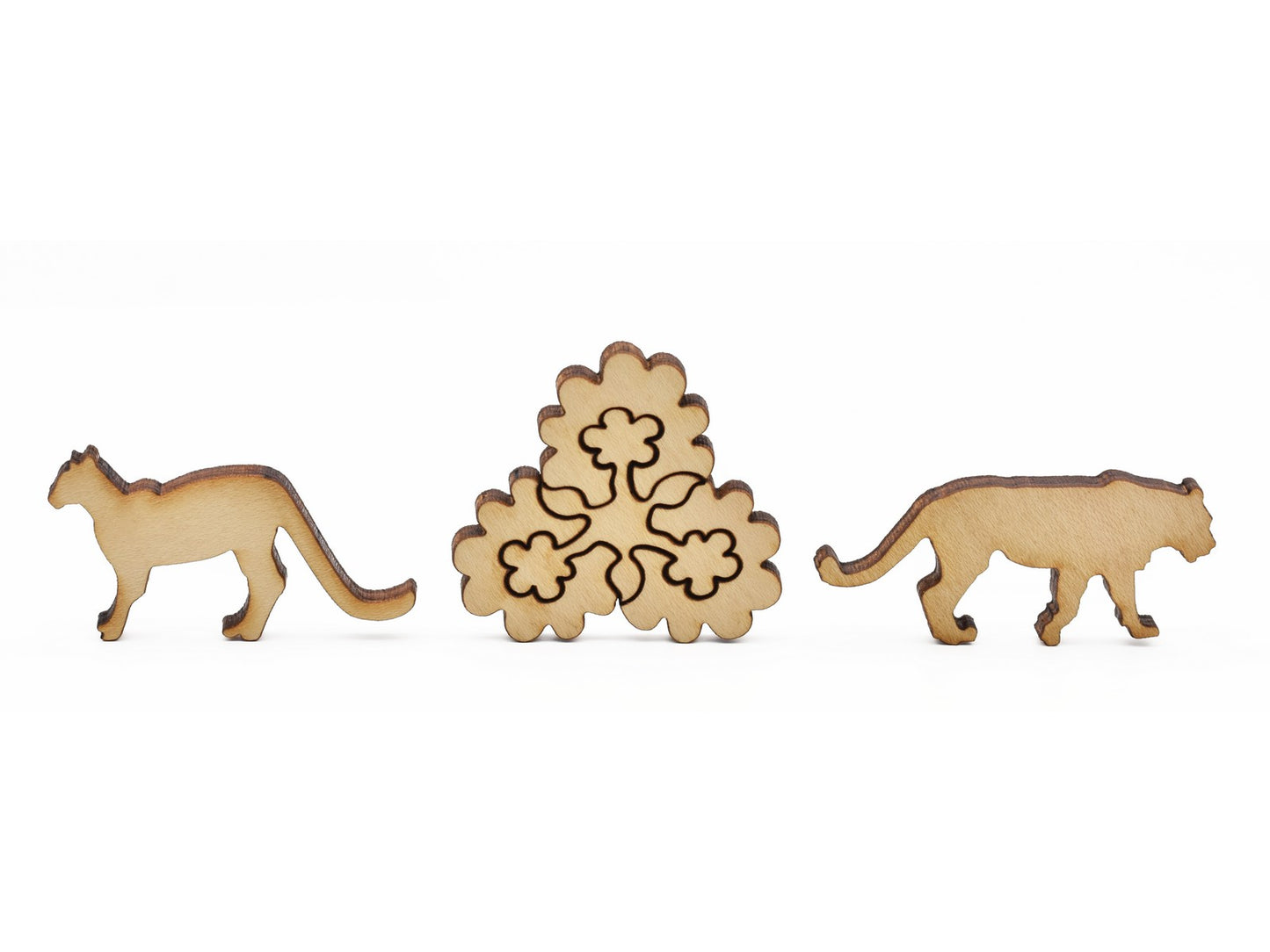 A closeup of pieces in the shape of flowers and jaguars.