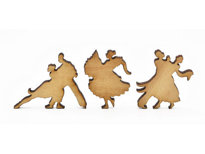 A closeup of pieces in the shape of people dancing.