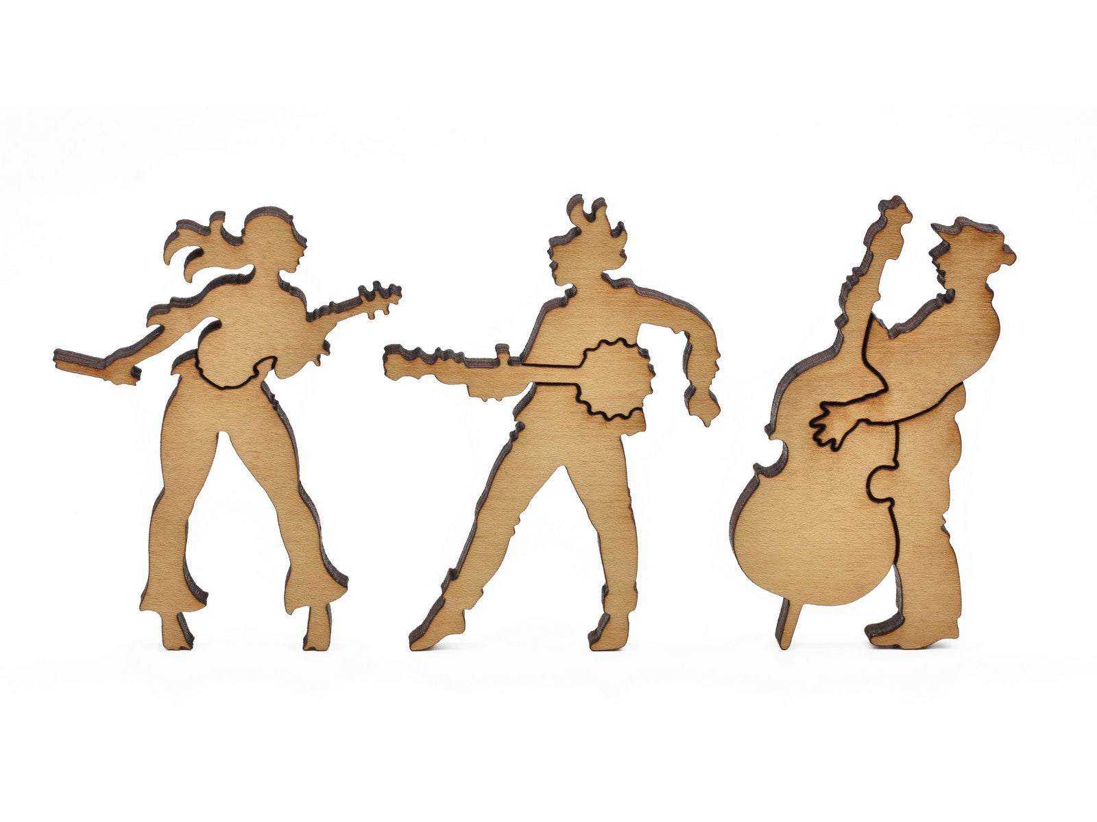 A closeup of pieces in the shape of three musicians.