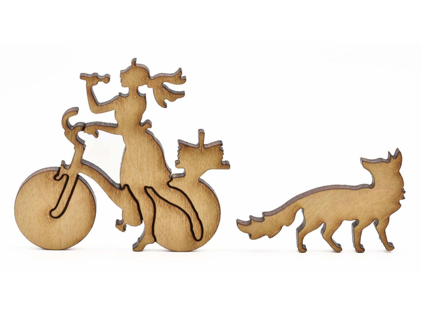 A closeup of pieces in the shape of a person with a bike and a fox.