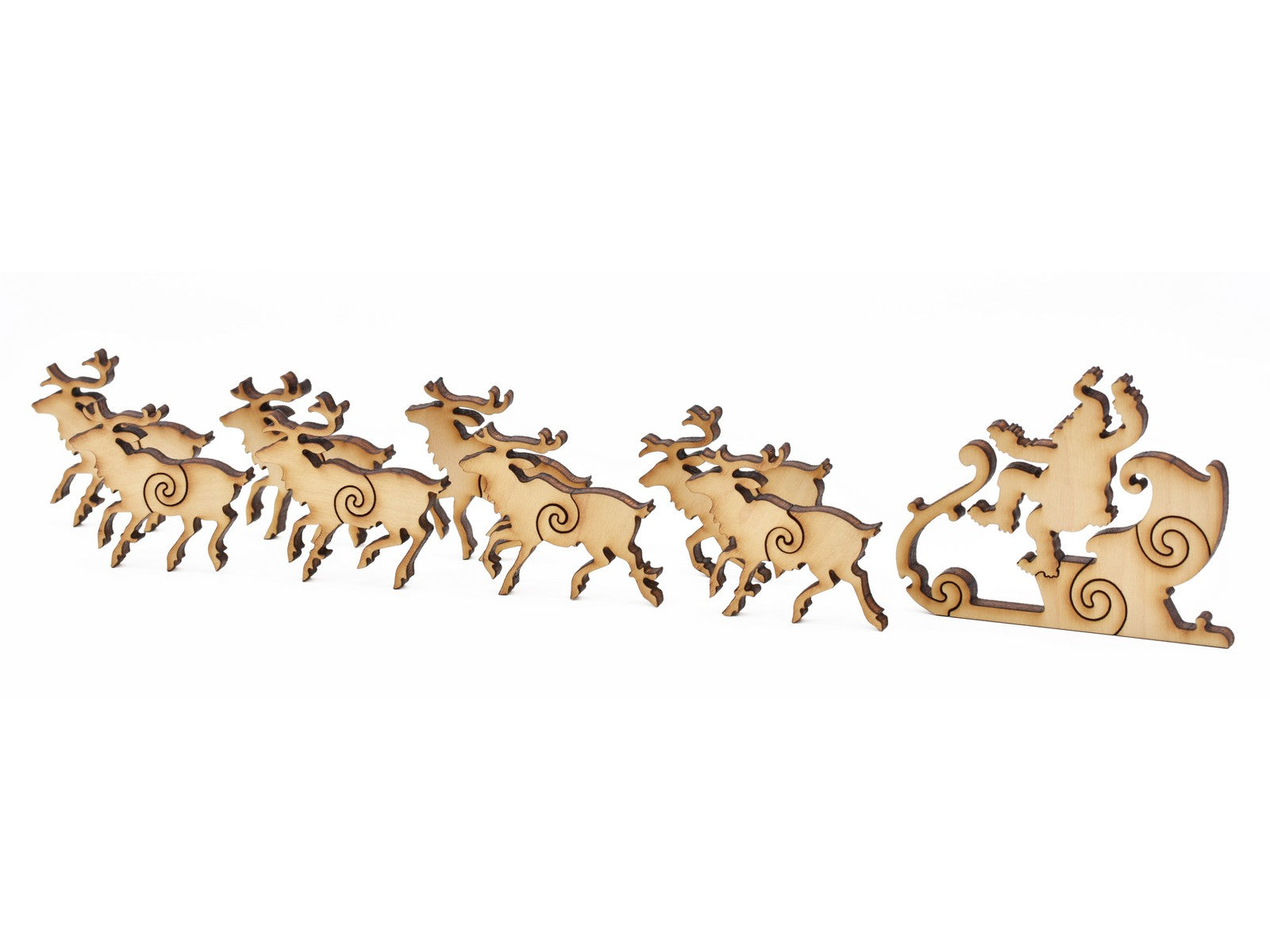 A closeup of pieces in the shape of Santa and his sleigh.