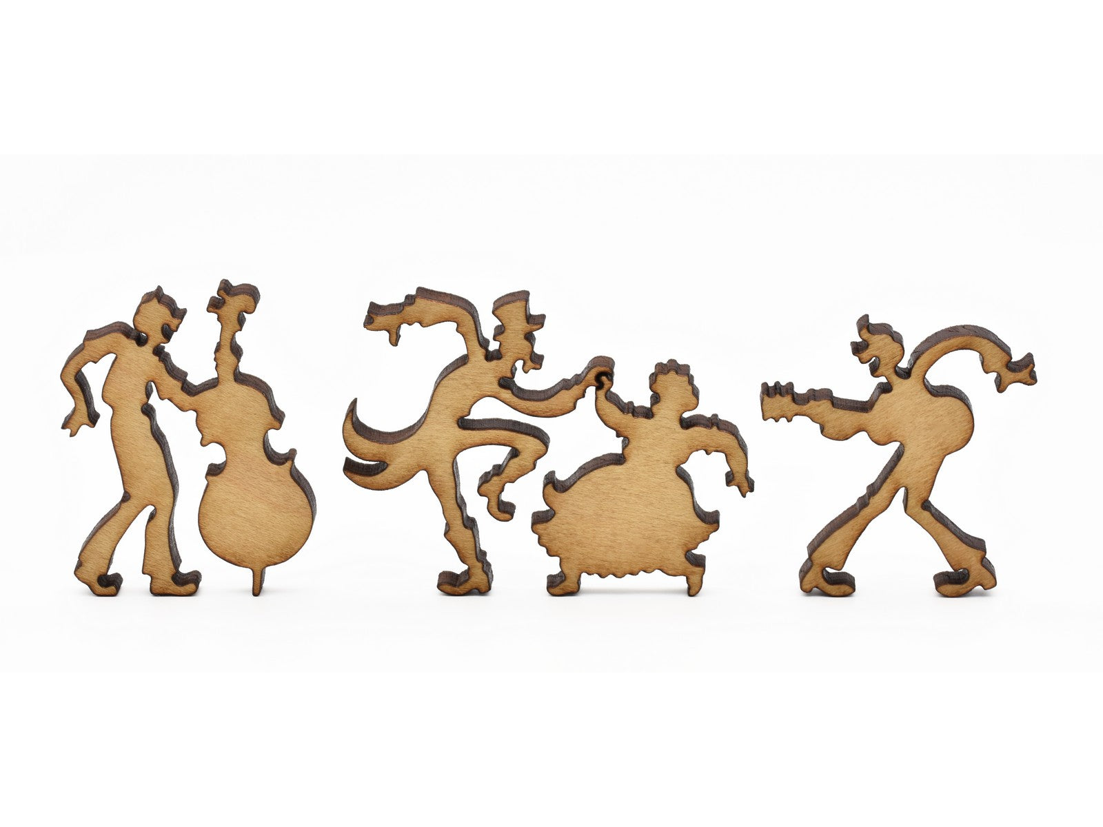 A closeup of pieces in the shape of people playing music and dancing.