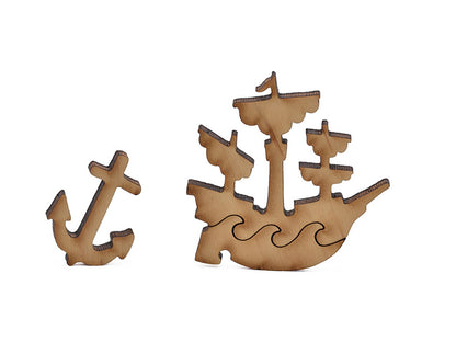 A closeup of pieces in the shape of a ship and an anchor.