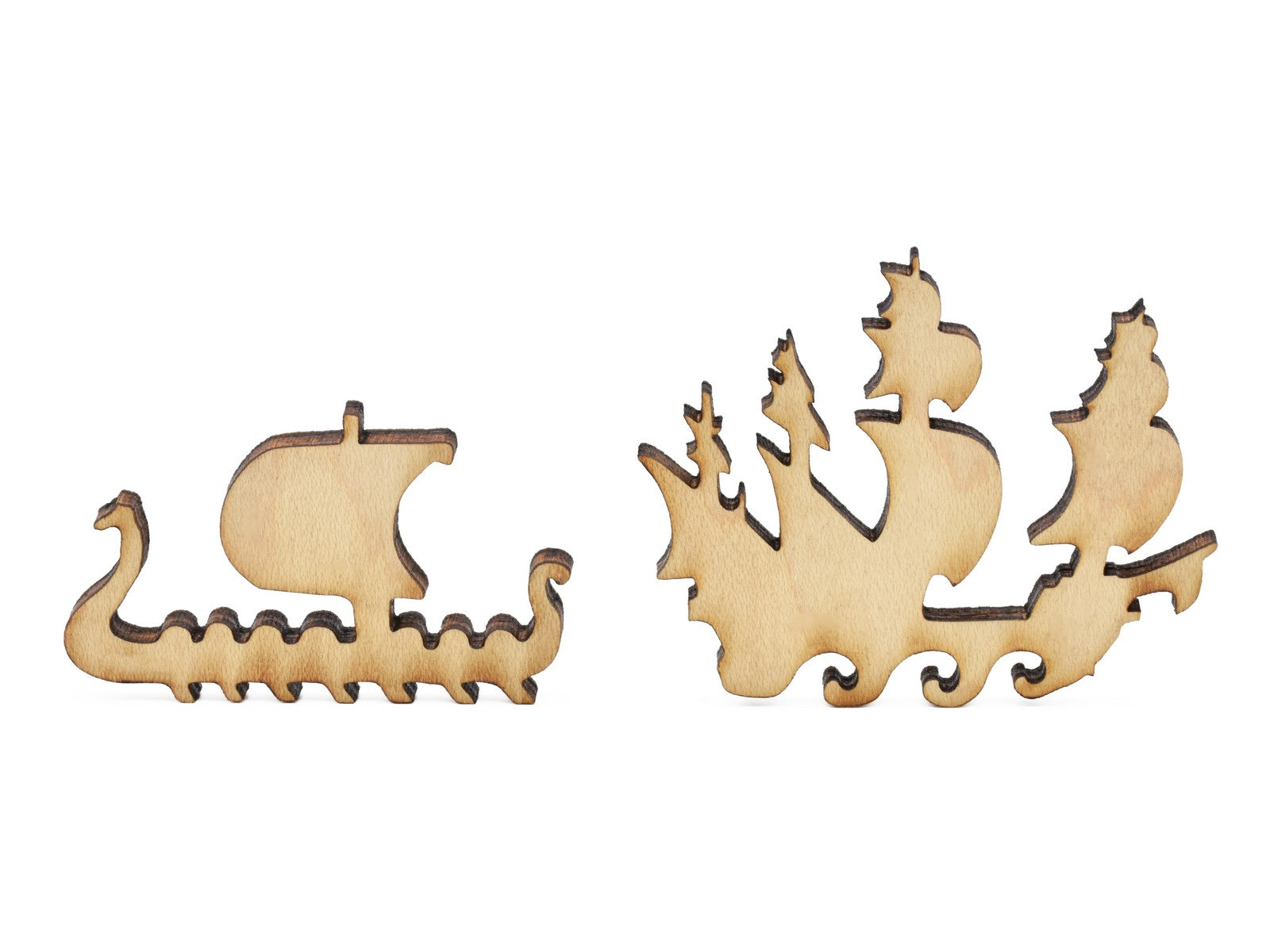 A closeup of pieces in the shape of two ships.