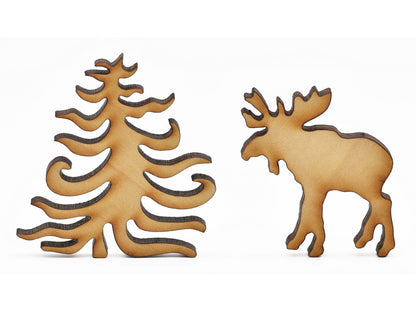 A closeup of pieces in the shape of a tree and a moose.
