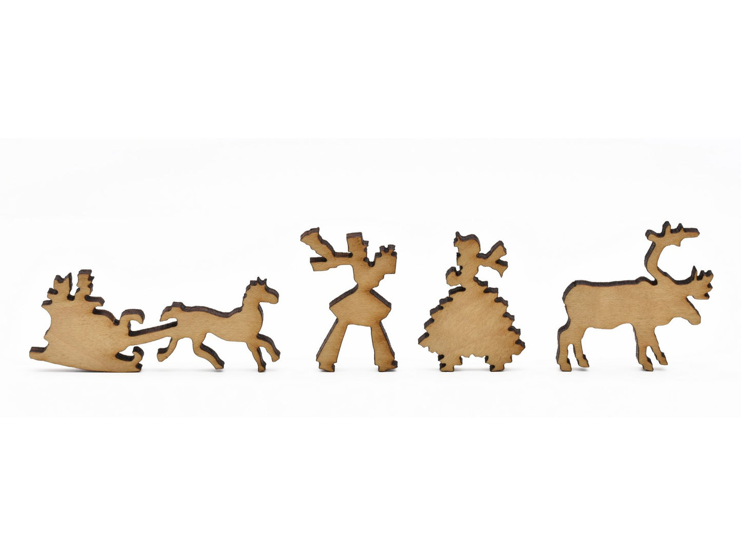 A closeup of pieces in the shape of a sleigh, a couple, and a reindeer.