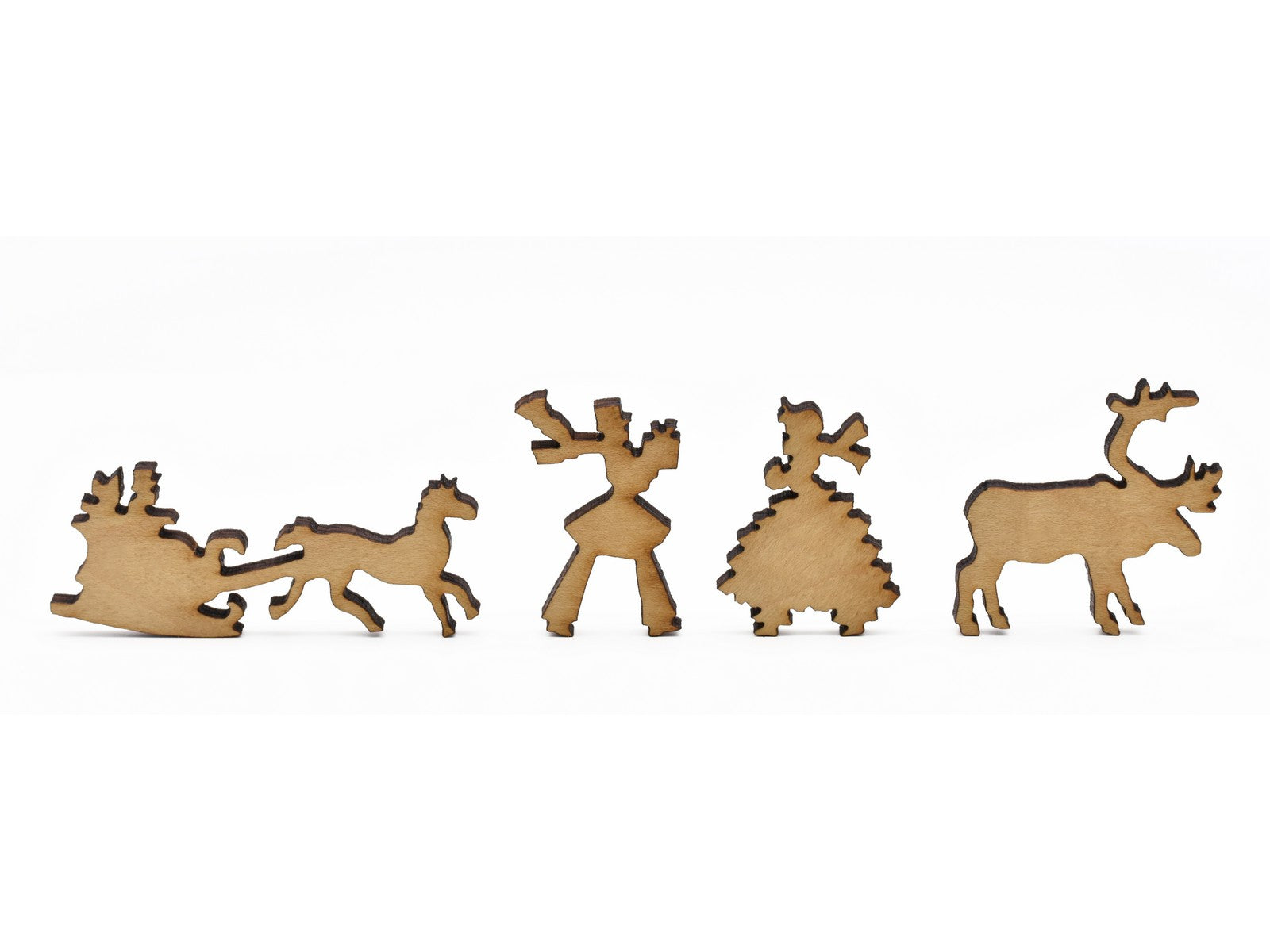 A closeup of pieces in the shape of a sleigh, a couple, and a reindeer.