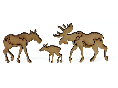 A closeup of pieces showing a family of moose.