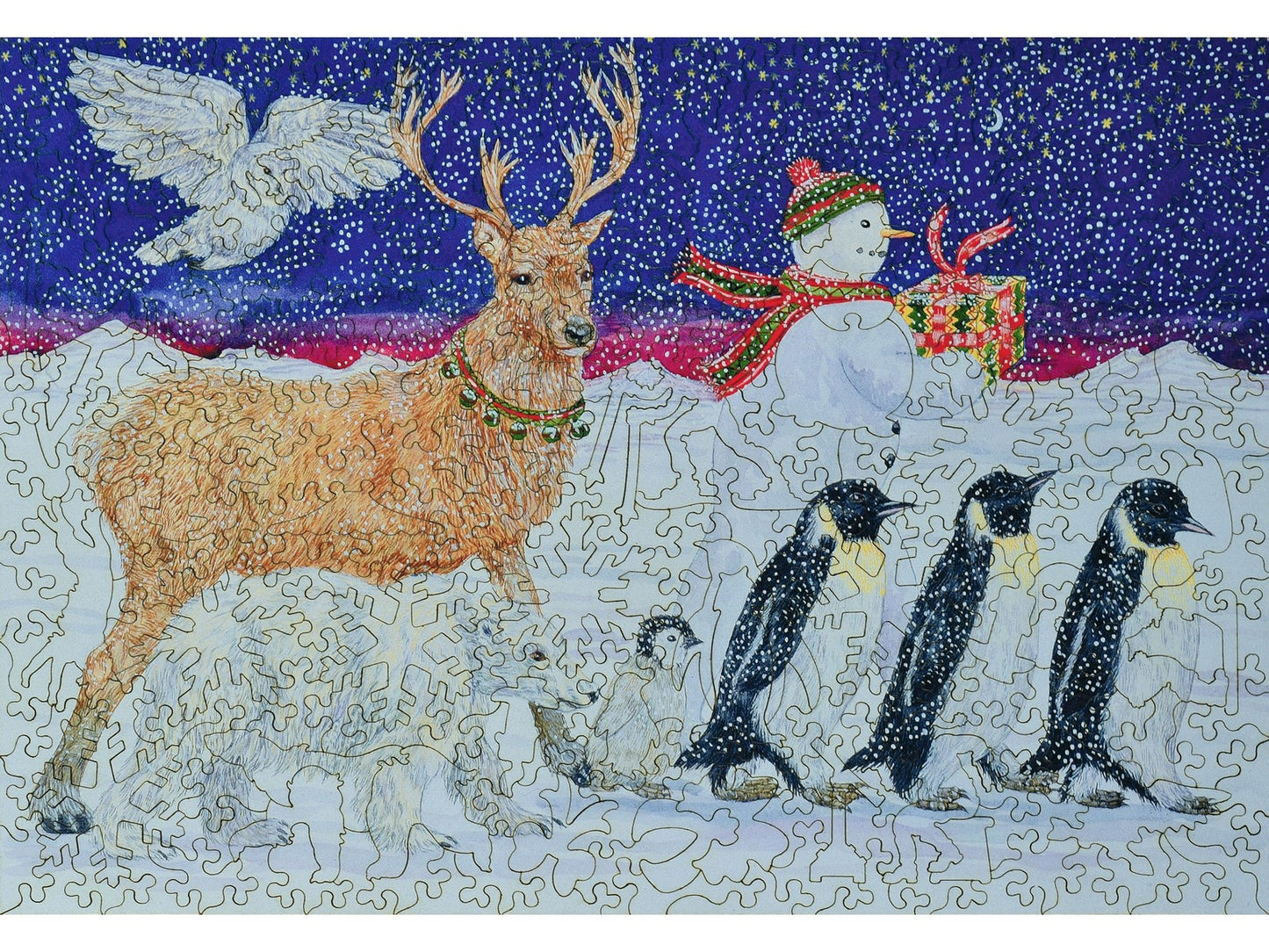 The front of the puzzle, A Present for Santa, showing penguins, reindeer, polar bears, and a snowman walking with a gift.