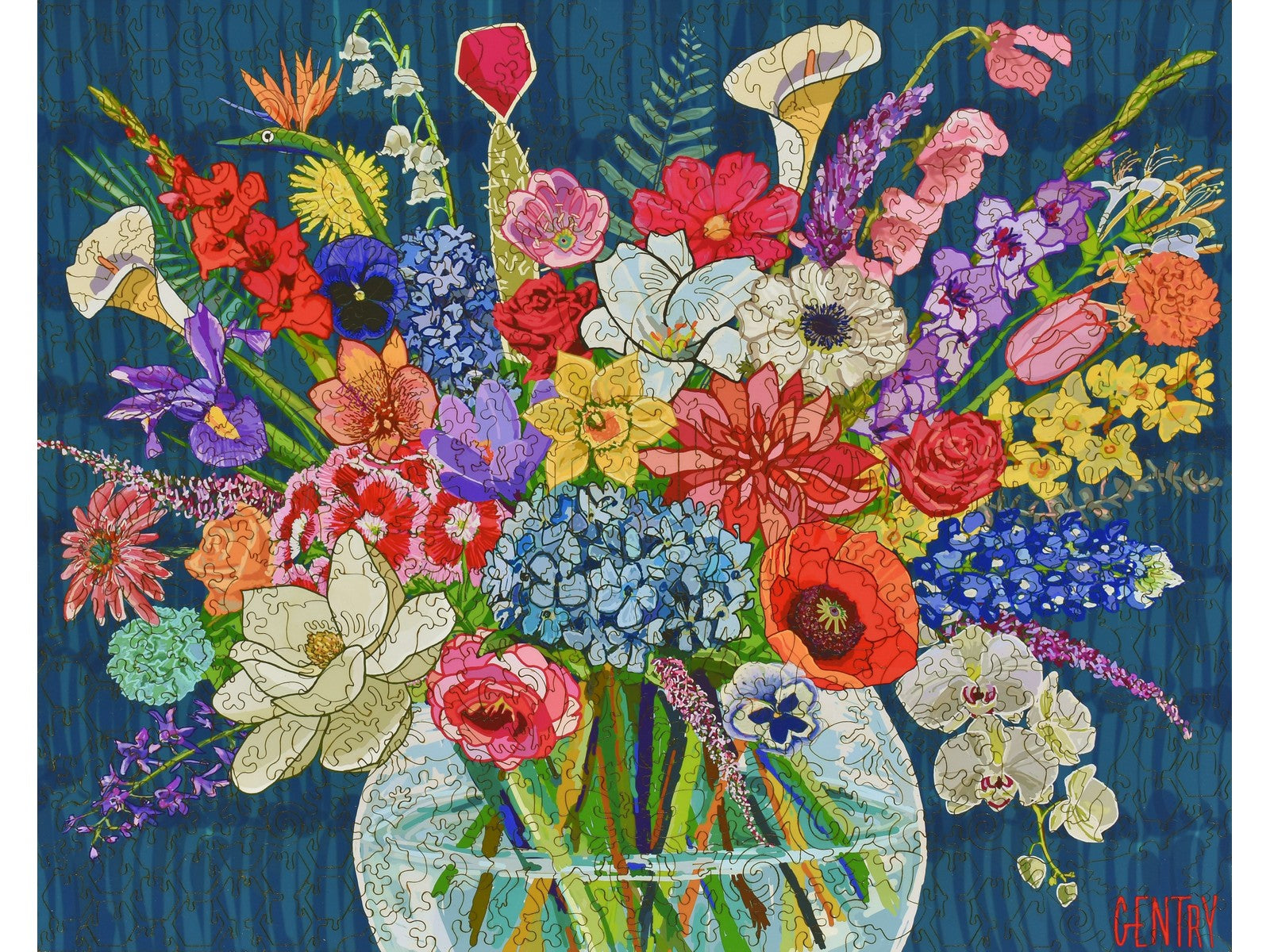 The front of the puzzle, Abundance, with a bouquet of flowers in a glass vase.