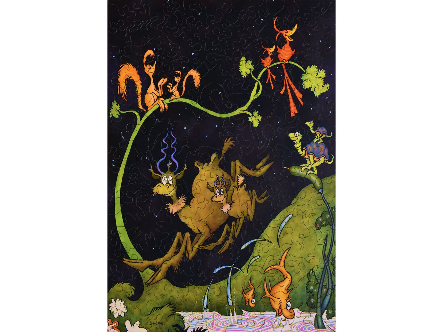 The front of the puzzle, After Dark in the Park, which shows pairs of  animals playing at night.