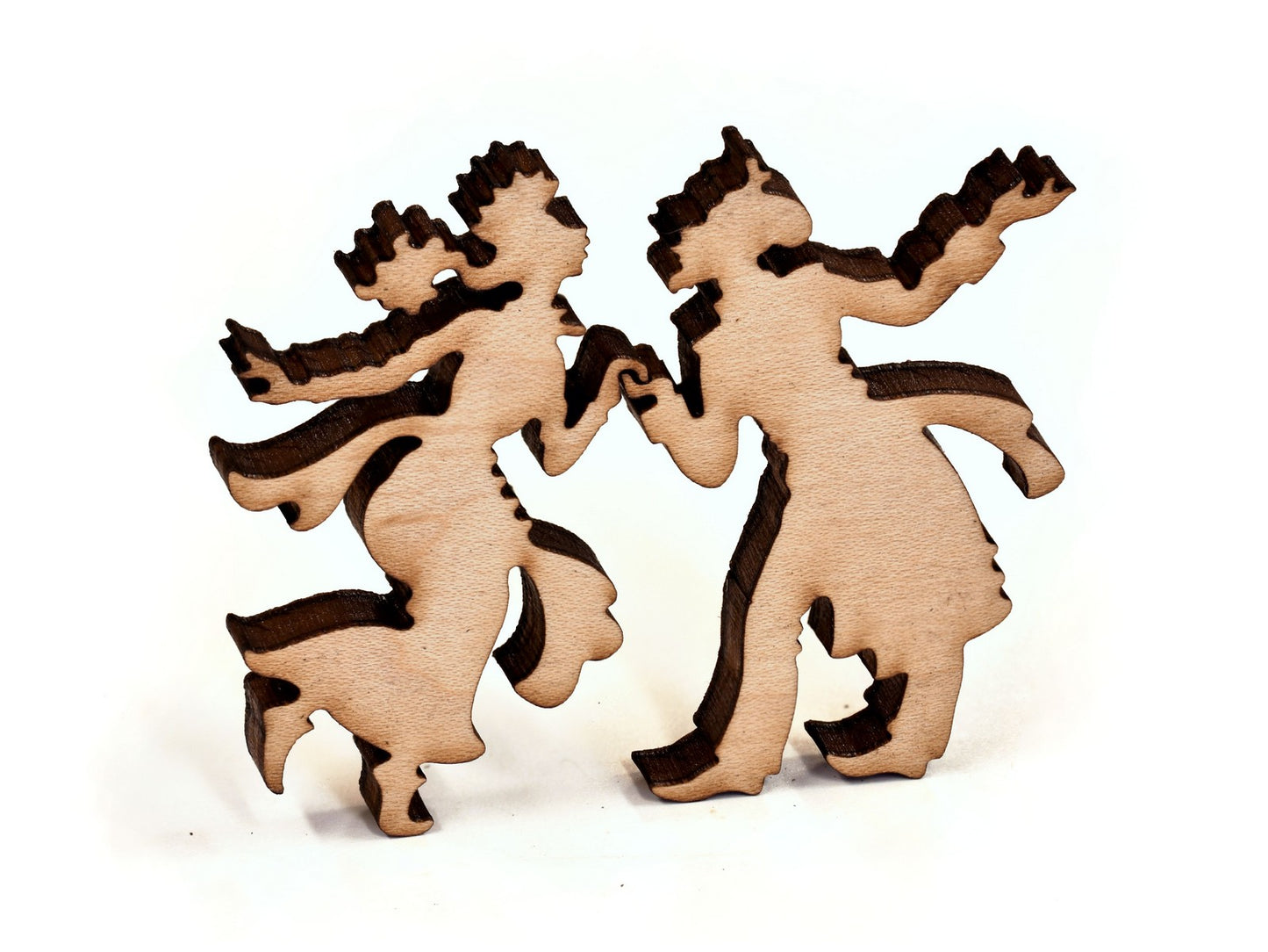 A closeup of pieces in the shape of a couple dancing.