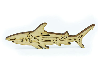 A closeup of pieces in the shape of a shark.
