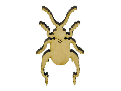 A closeup of pieces in the shape of a beetle.