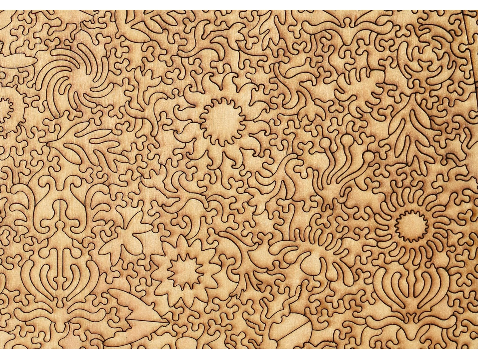 A closeup of the back of the puzzle, Bug Garden Terrarium, showing the detail in the pieces.