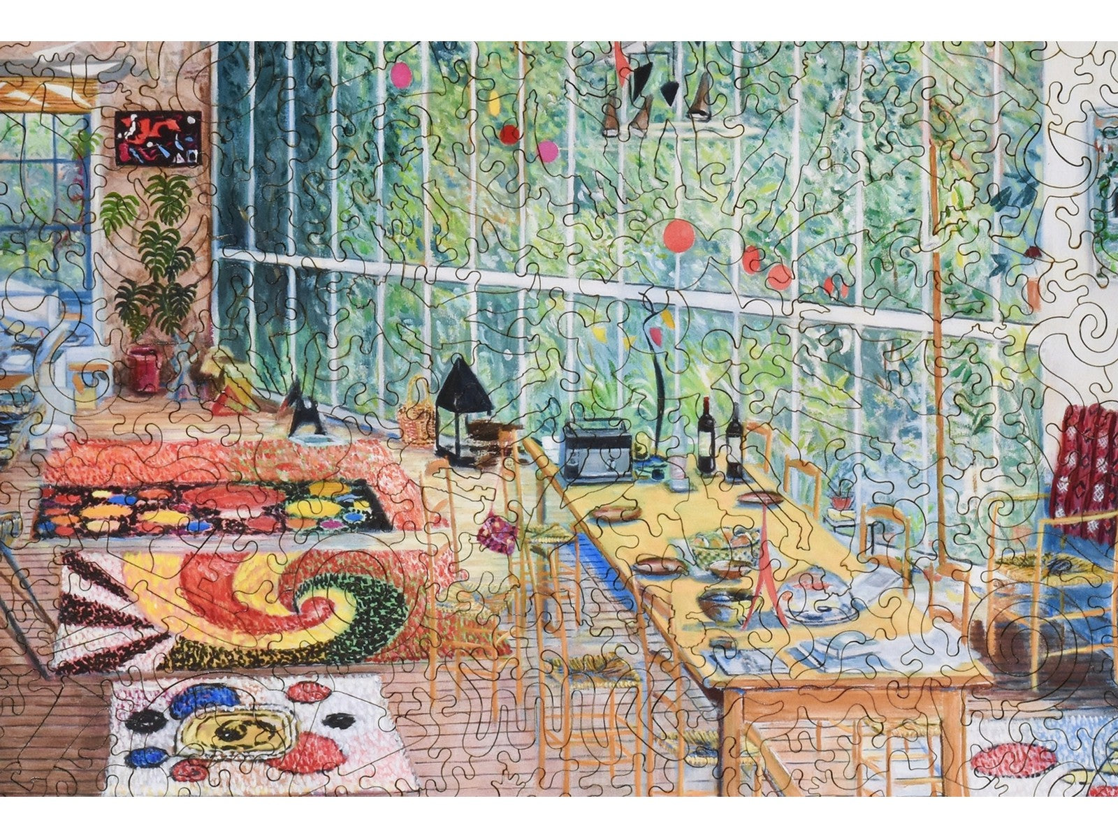 A closeup of the front of the puzzle, Calder's Studio, showing the detail in the pieces.