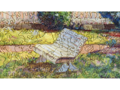 A closeup of the front of the puzzle, Coastal Landscape with Blooming Lilac Bush.