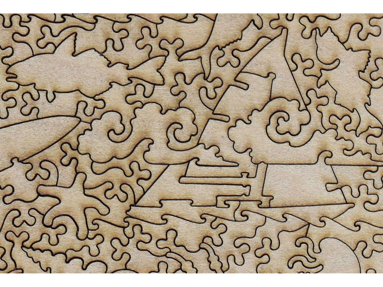 A closeup of the back of the puzzle, Étretat: The Beach and the Falaise d'Amont, showing the detail in the pieces.