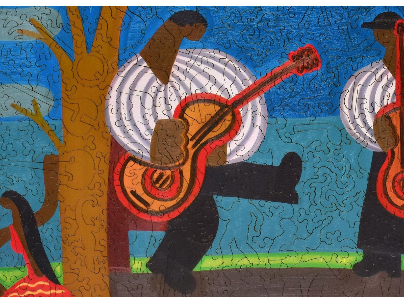 A closeup of the front of the puzzle, The Festival of Django Reinhardt, showing the detail in the pieces.