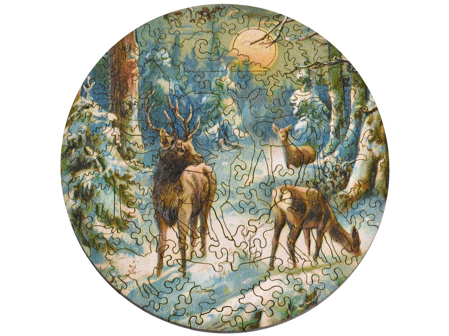 The front of the round puzzle, Foraging at First Light, with deer eating in the snow.