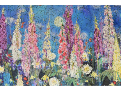 A closeup of the front of the puzzle, Foxgloves and Alliums, showing the detail in the pieces.