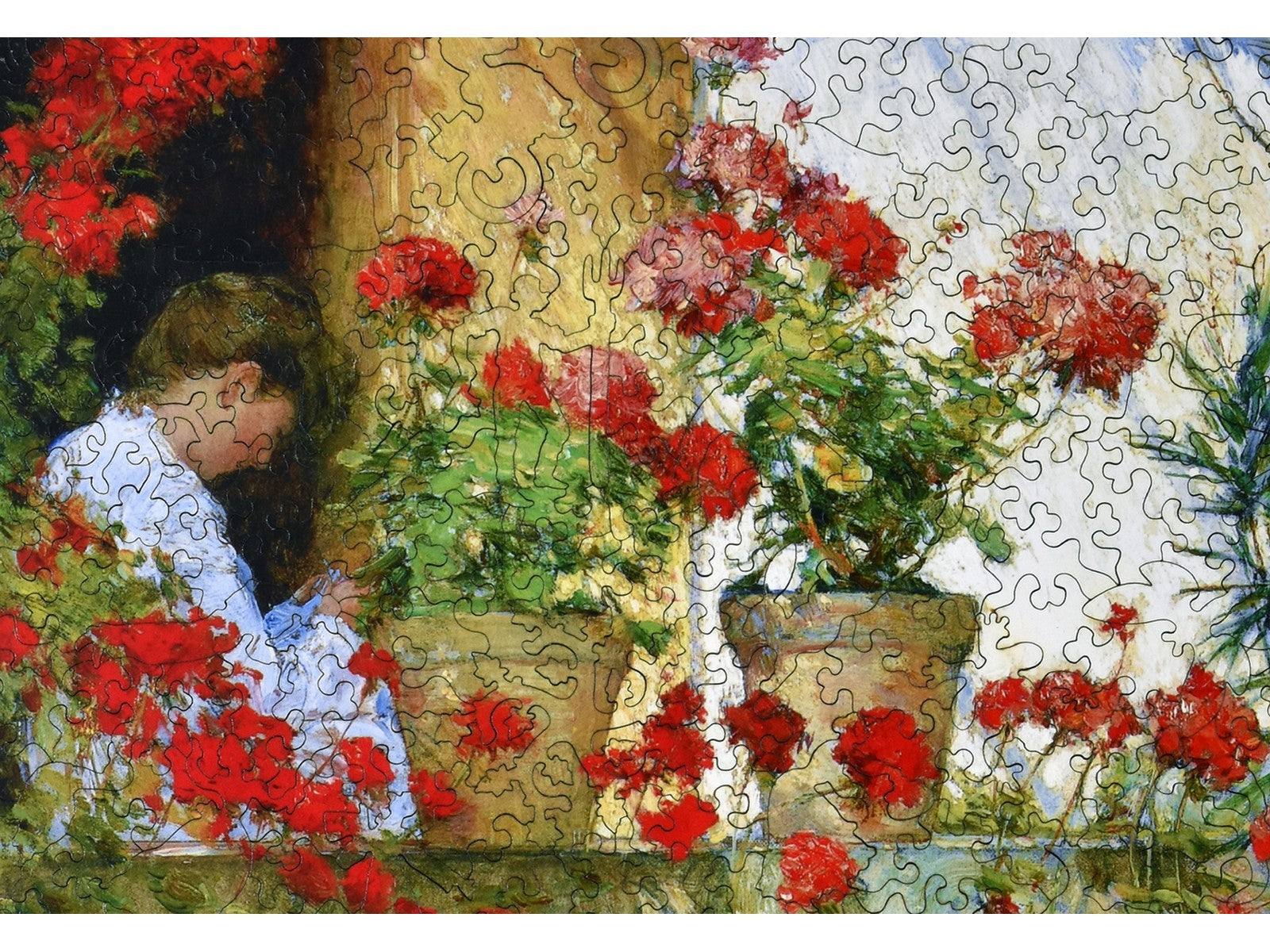 A closeup of the front of the puzzle, Geraniums, showing the detail in the pieces.