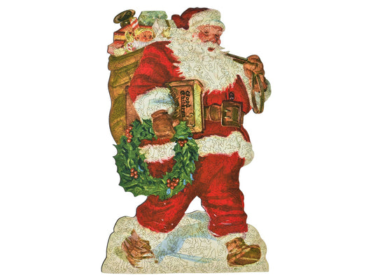 The front of the puzzle, Gifts for Good Children, which shows Santa Claus carrying a sack of toys and a book titled "good children".