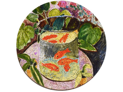 The front of the small round puzzle, Goldfish, by Henri Matisse.
