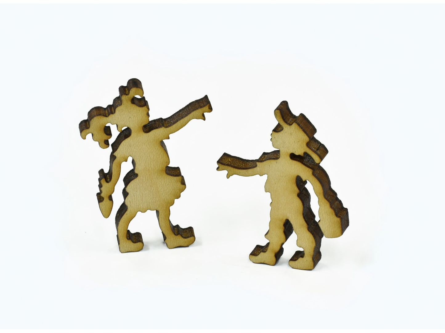 A closeup of pieces in the shape of two children.
