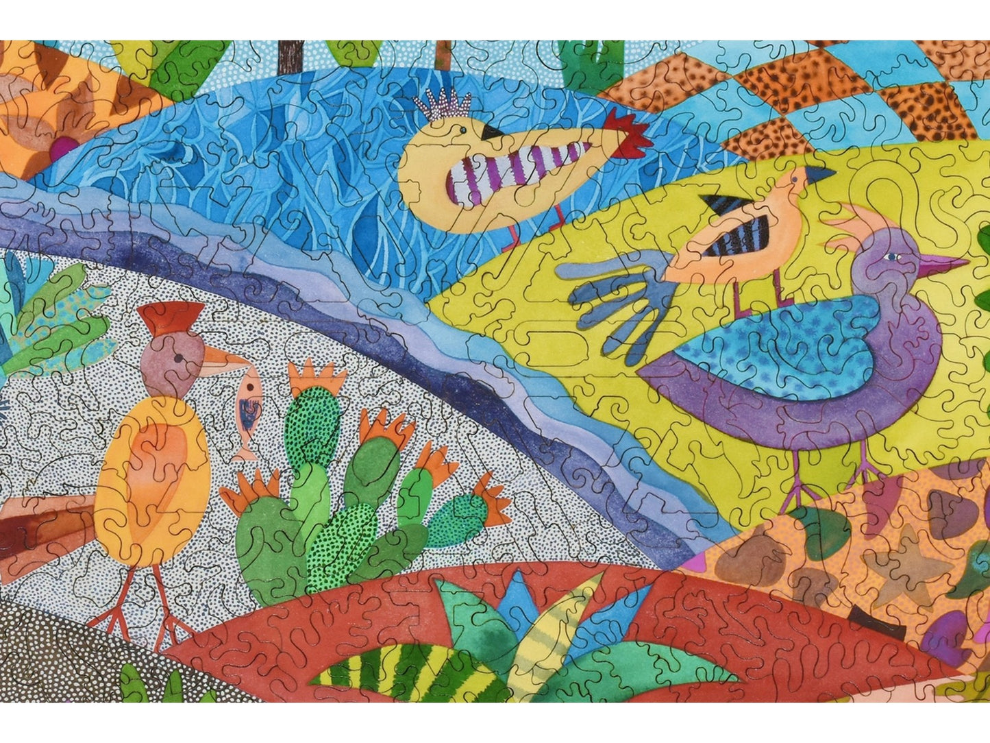 A closeup of the front of the puzzle, Living in Bird World, showing the detail in the pieces.