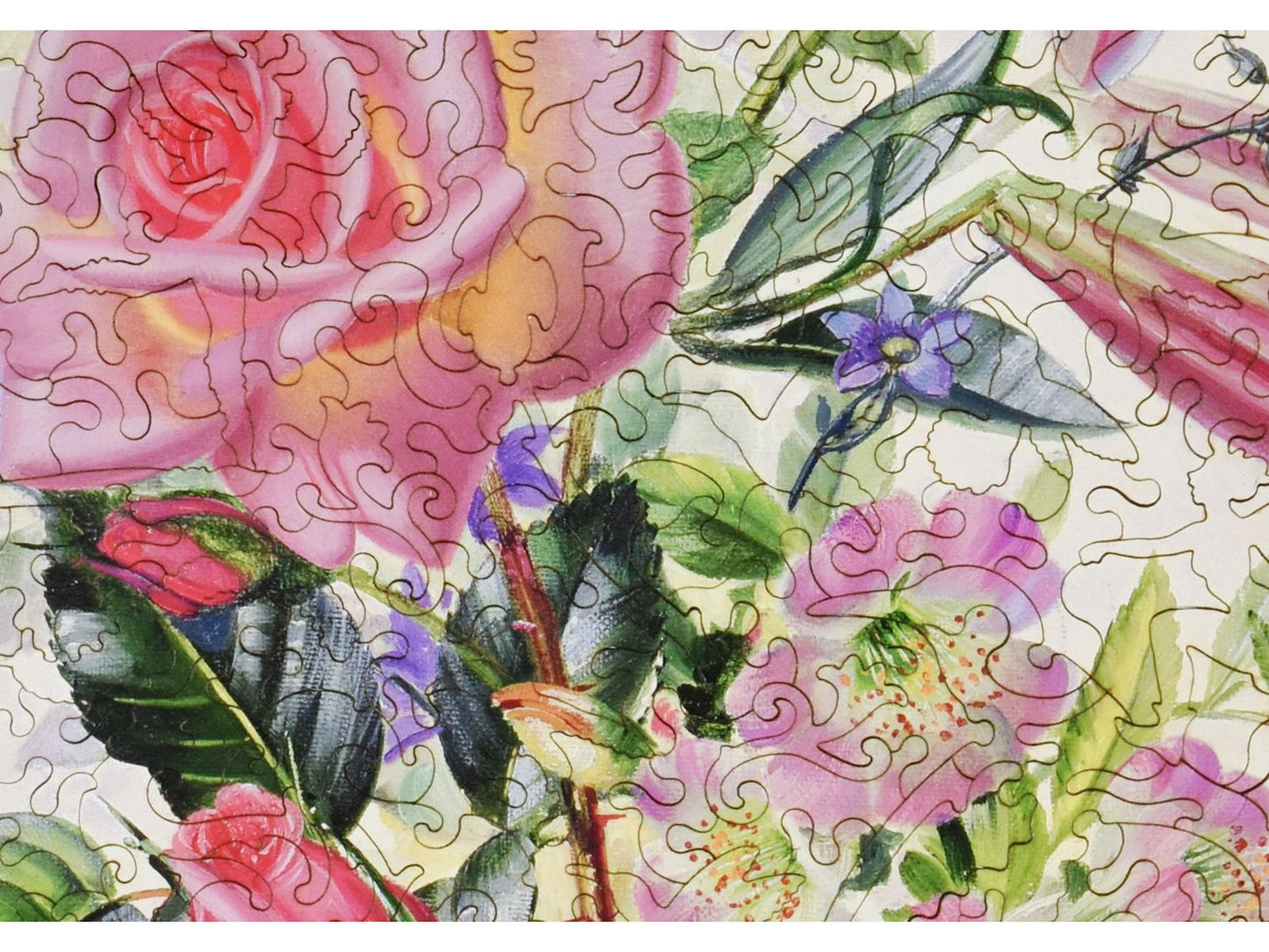A closeup of the front of the puzzle, Pink Bouquet, showing the detail in the pieces.