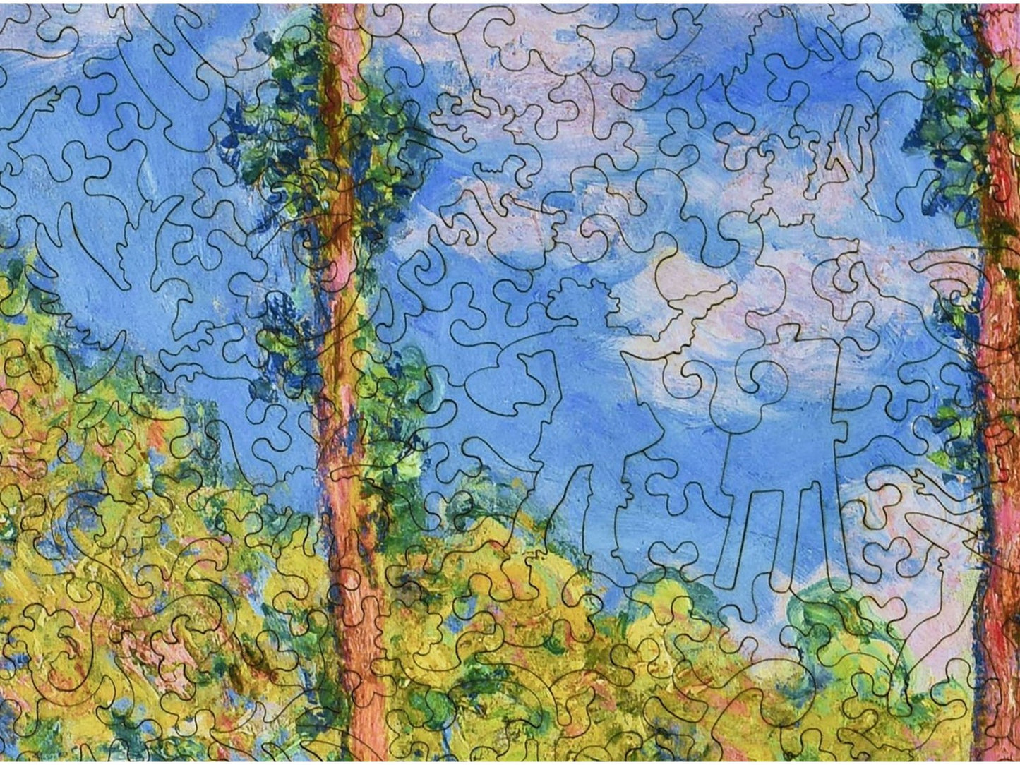 A closeup of the front of the puzzle, Poplars in the Sun, showing the detail in the pieces.